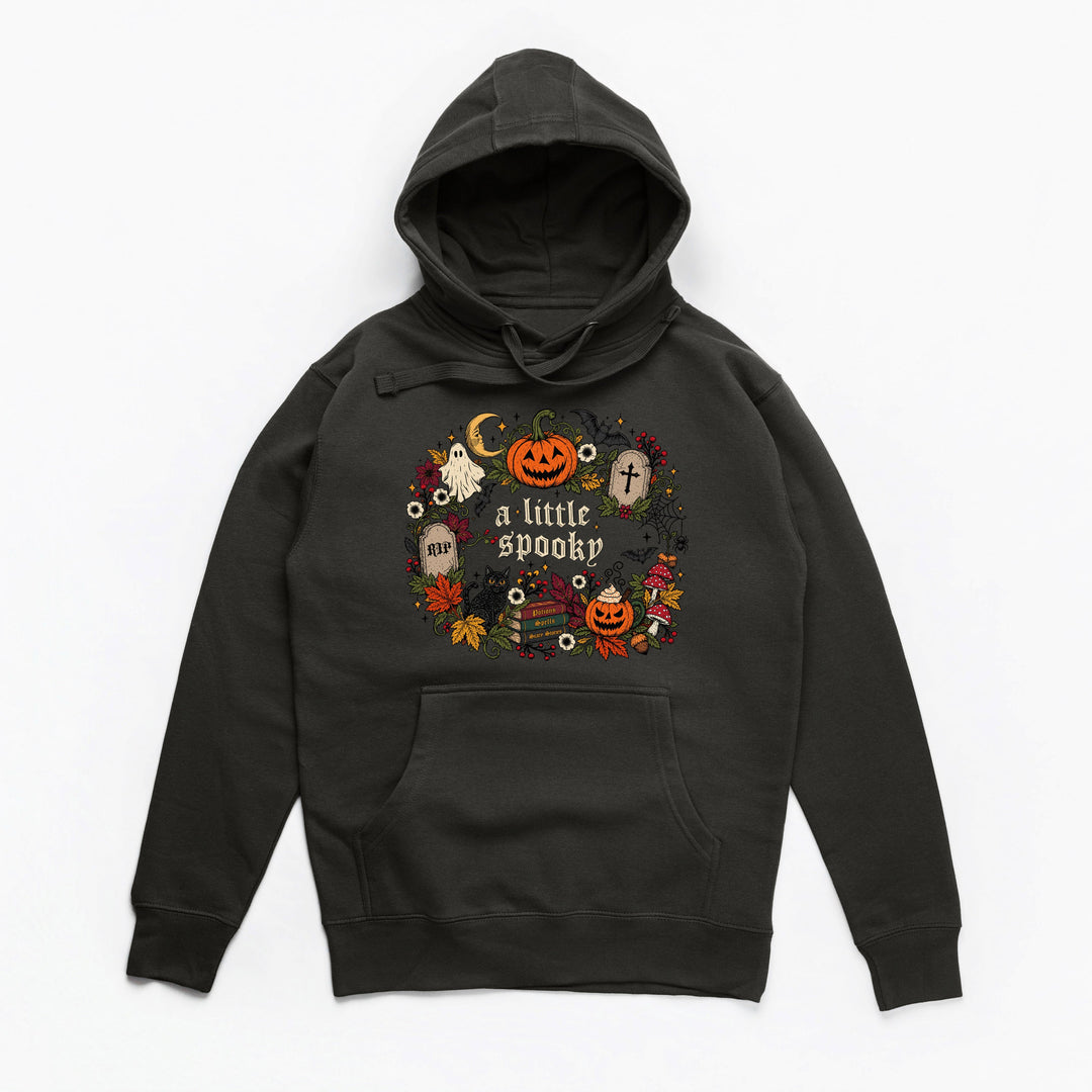A black pullover hoodie with a festive Halloween graphic on the chest featuring pumpkins, ghosts, a moon, and the text 'a little spooky' in white, shown against a plain white background.